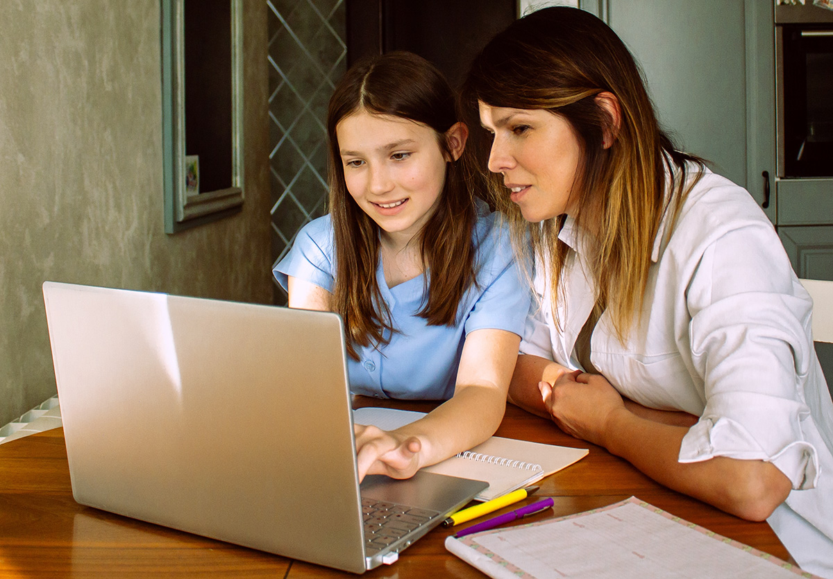 Parent and child learning together at home